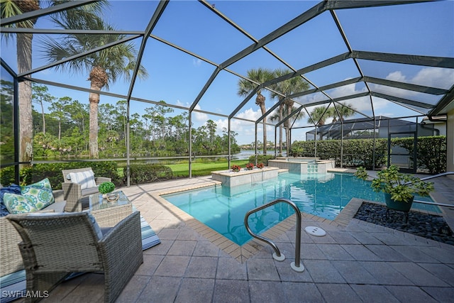 view of swimming pool featuring a patio area and glass enclosure