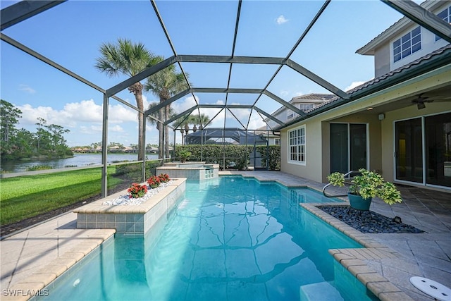 view of swimming pool with a lanai, a patio area, an in ground hot tub, and a water view