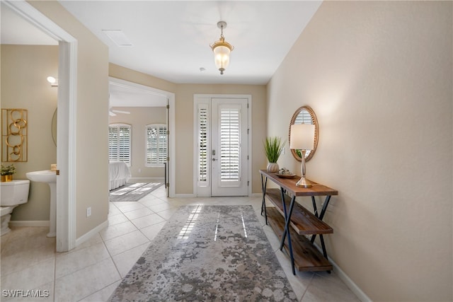 entryway featuring light tile patterned floors