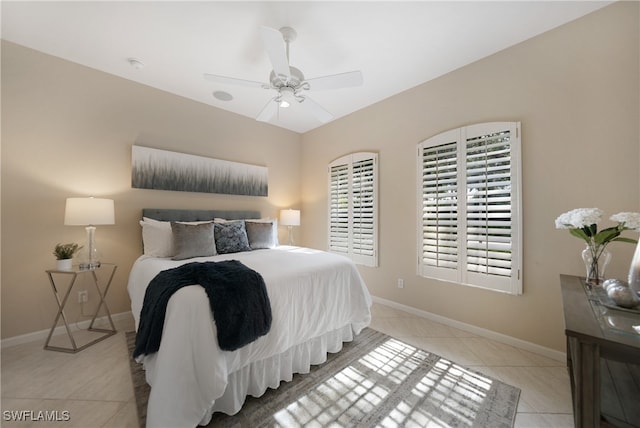 tiled bedroom with ceiling fan