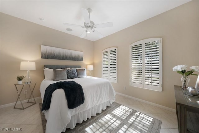 tiled bedroom with ceiling fan