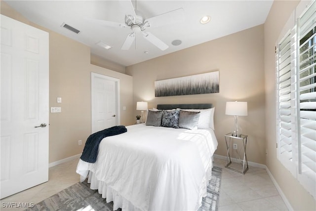 bedroom with light tile patterned flooring and ceiling fan