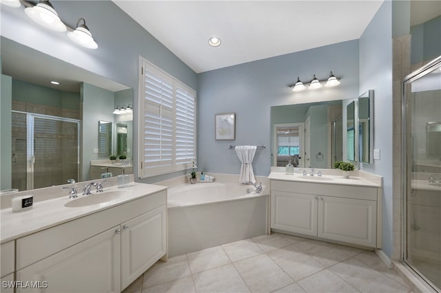 bathroom with separate shower and tub, tile patterned flooring, and double vanity