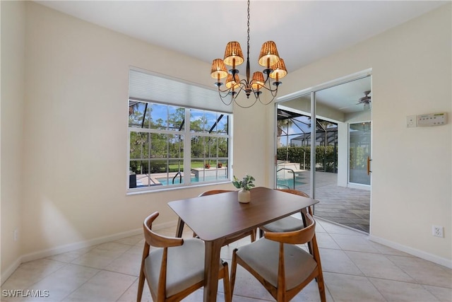 dining space featuring light tile patterned floors and ceiling fan with notable chandelier