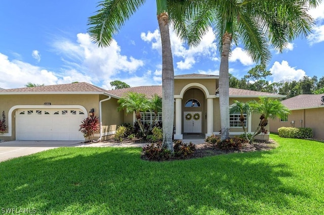 view of front of home featuring a garage and a front yard