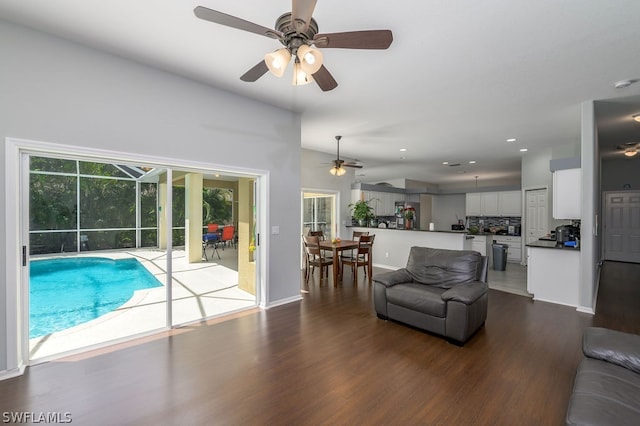 view of swimming pool featuring ceiling fan