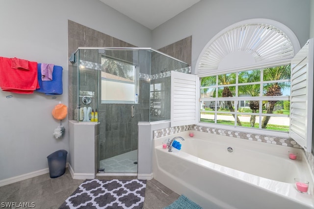 bathroom with tile patterned floors and separate shower and tub