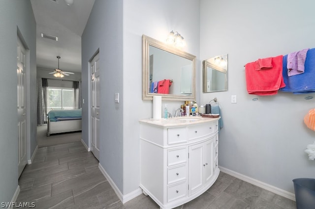 bathroom featuring vanity, lofted ceiling, and ceiling fan