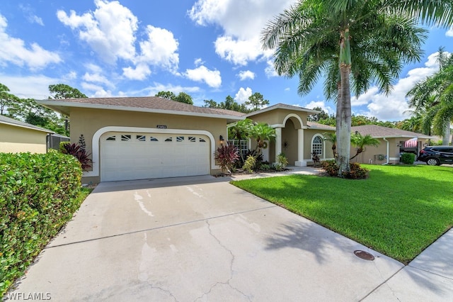 view of front of house with a garage and a front yard