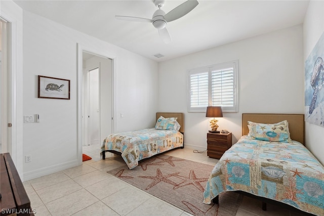 bedroom featuring light tile patterned flooring and ceiling fan