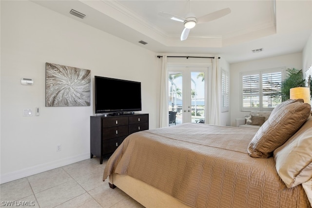 bedroom with light tile patterned floors, french doors, a tray ceiling, access to outside, and ceiling fan