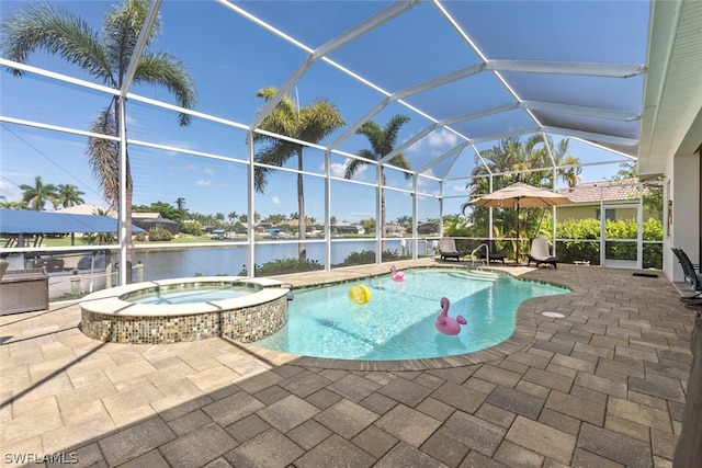 view of swimming pool featuring glass enclosure, a water view, an in ground hot tub, and a patio