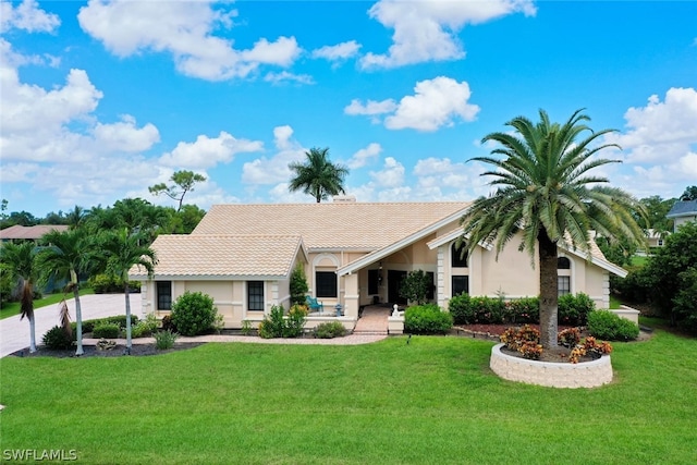 single story home with a front lawn