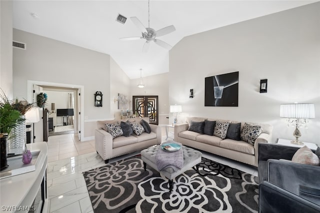 tiled living room featuring high vaulted ceiling, french doors, and ceiling fan