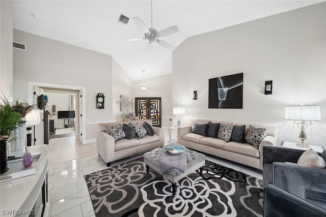 living room featuring ceiling fan and high vaulted ceiling