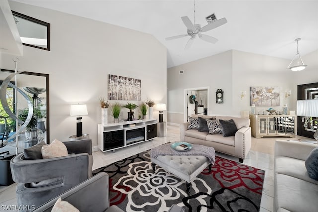 living room with light tile patterned flooring, high vaulted ceiling, and ceiling fan