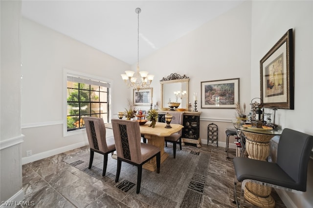 tiled dining space featuring an inviting chandelier and high vaulted ceiling