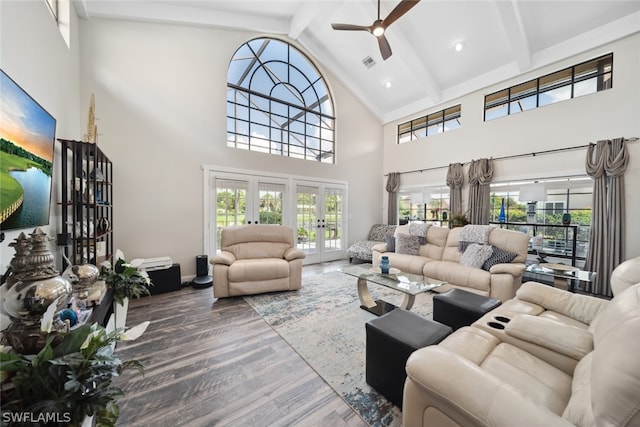 living room featuring hardwood / wood-style floors, french doors, beam ceiling, high vaulted ceiling, and ceiling fan