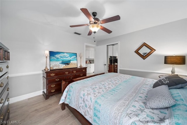 bedroom with ceiling fan, a closet, and light wood-type flooring