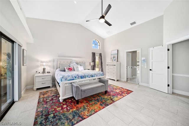 tiled bedroom featuring high vaulted ceiling and ceiling fan