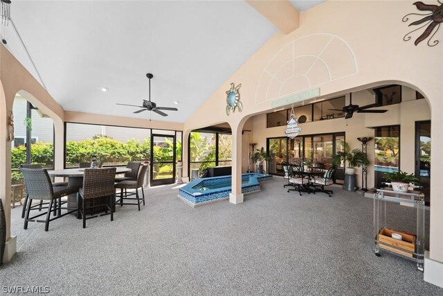 view of patio / terrace with an in ground hot tub and ceiling fan