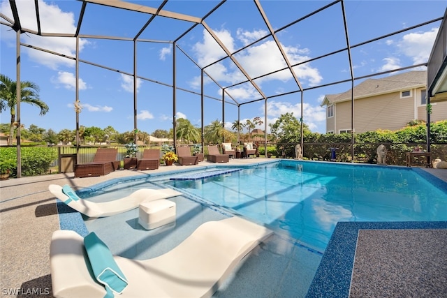 view of pool featuring a patio area and a lanai