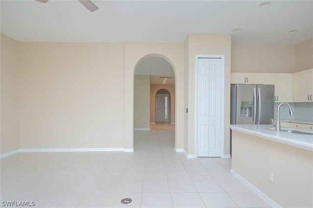 interior space with sink and light tile patterned floors