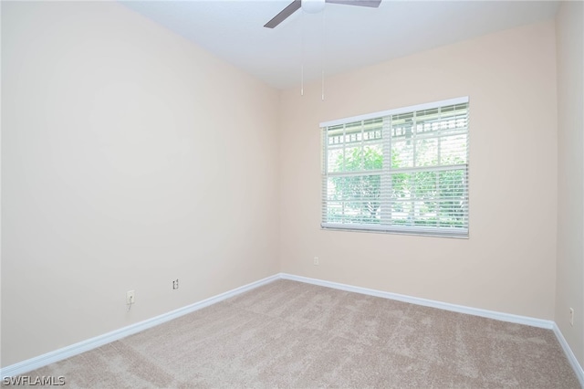 empty room with carpet floors and ceiling fan