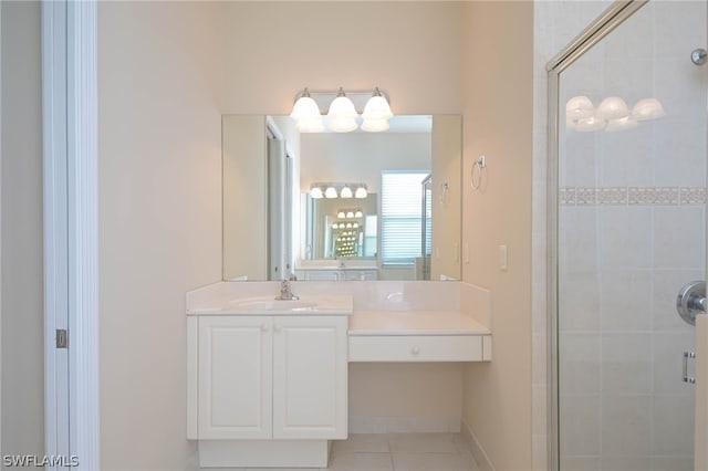 bathroom with vanity, a shower with door, and tile patterned flooring