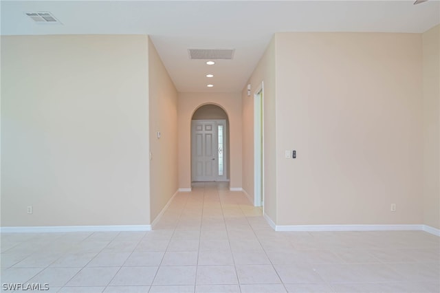 hall with light tile patterned flooring