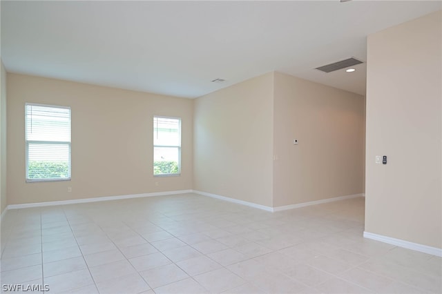 spare room with light tile patterned floors