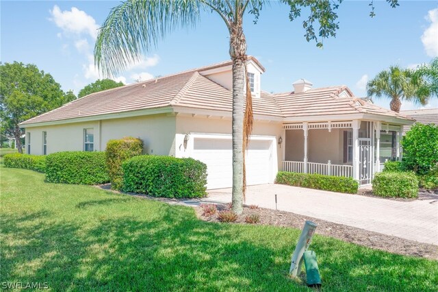 view of side of home with a garage and a yard