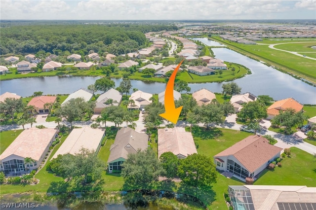 birds eye view of property featuring a water view