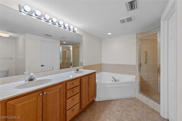 full bathroom with toilet, separate shower and tub, a textured ceiling, vanity, and tile patterned flooring