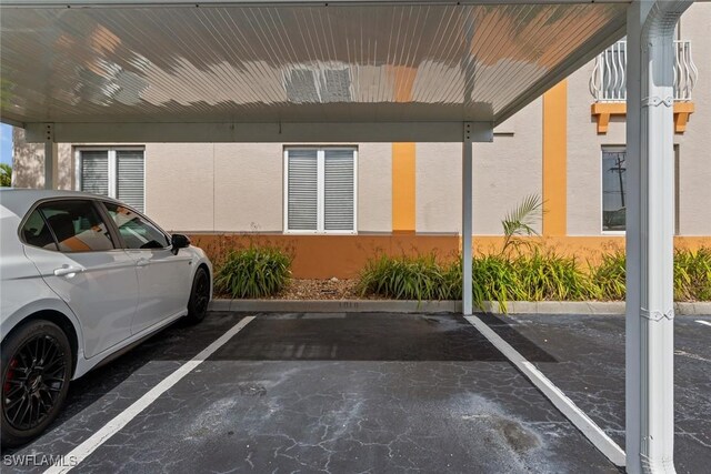 view of car parking with a carport