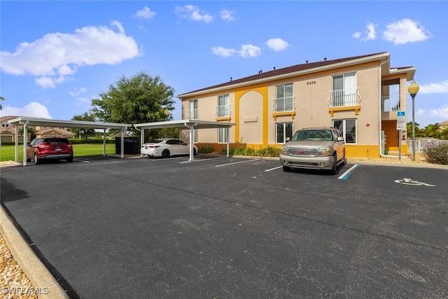 view of parking with a carport