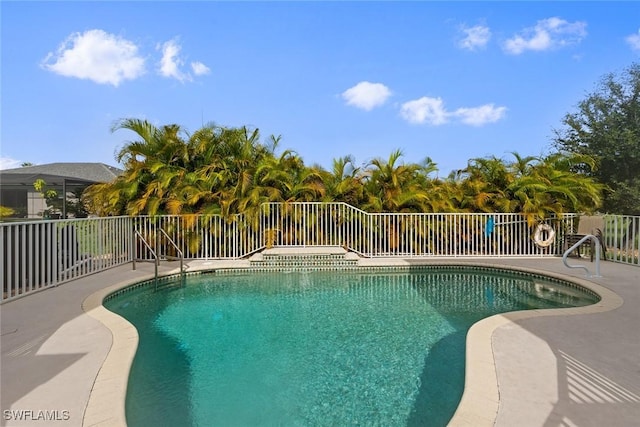 view of pool with a fenced in pool, a patio, and fence