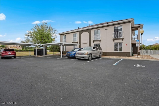 view of partially covered parking lot