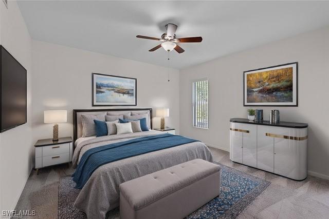 bedroom with carpet, baseboards, and ceiling fan