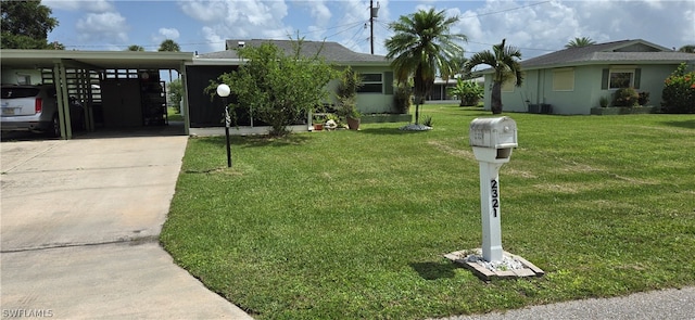 view of front facade with a carport, central AC unit, and a front yard