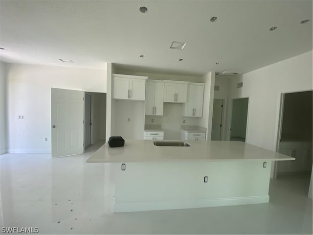 kitchen featuring white cabinetry and a spacious island