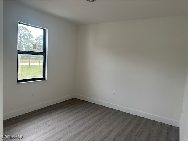 unfurnished room featuring wood-type flooring