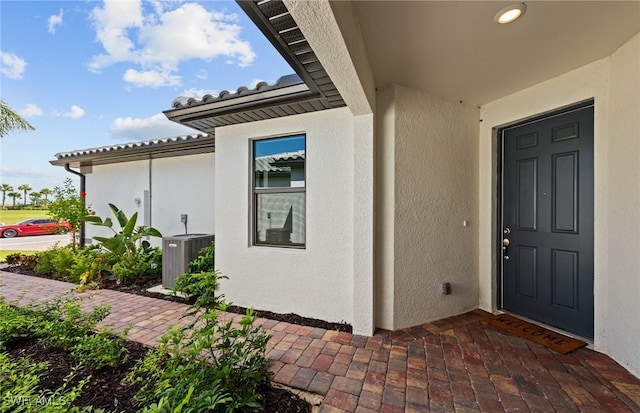 doorway to property with cooling unit