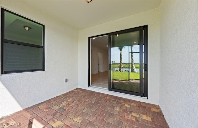 view of patio with a water view