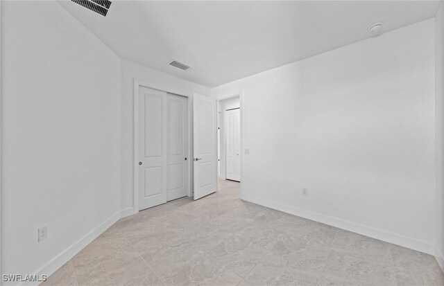 unfurnished bedroom featuring a closet