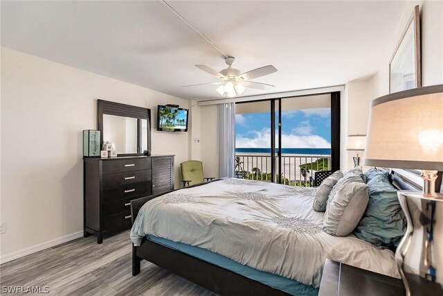 bedroom with access to outside, ceiling fan, and light hardwood / wood-style floors