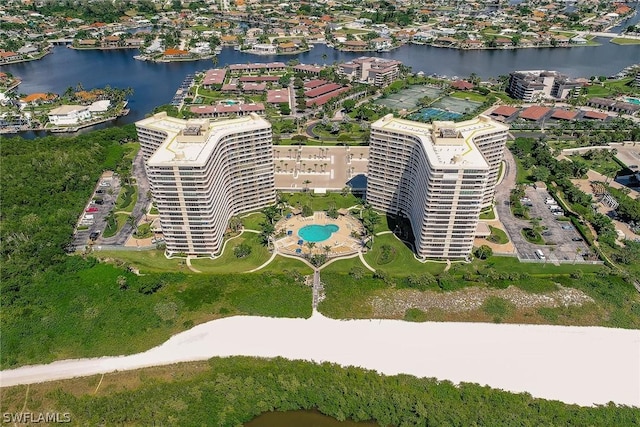 birds eye view of property featuring a view of city and a water view