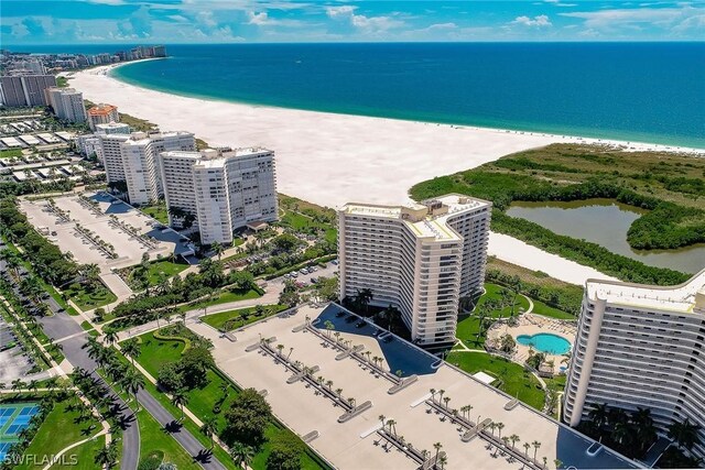 bird's eye view featuring a water view and a view of the beach