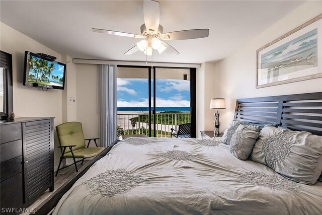 bedroom featuring access to outside, hardwood / wood-style floors, and ceiling fan