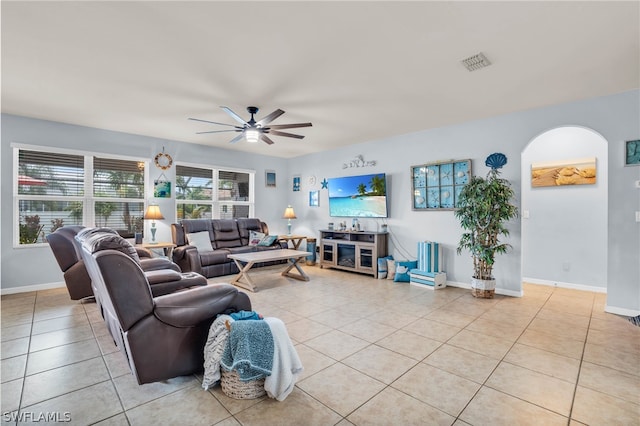 tiled living room with ceiling fan